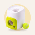 Treat reward ball machine with tennis ball